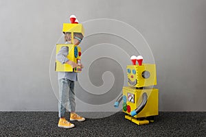 Happy child with robot have an idea