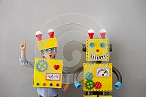 Happy child with robot have an idea