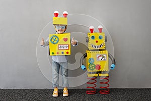 Happy child with robot have an idea