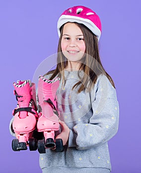 Happy child with roller skates. Little girl has roller skates. Fitness health and energy. race workout of teen girl