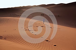 Happy child running through the desert