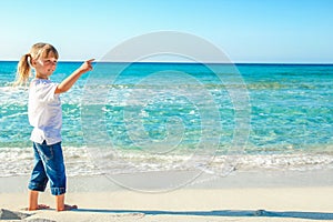 Happy child by the sea in the open air