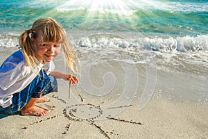 Happy child by the sea in the open air