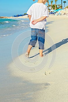 Happy child by the sea in the open air