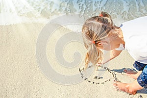 Happy child by the sea in the open air