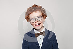 Happy child smart student boy in suit portrait