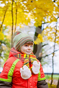 Happy child smiling in autumn park