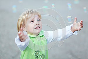 Happy child and soap bubbles