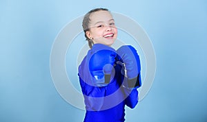 Happy child sportsman in boxing gloves. Fitness diet. energy health. workout of small girl boxer. punching knockout