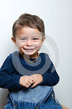 Happy child staring and smiling to the camera