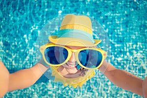 Happy child in swimming pool