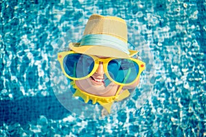 Happy child in swimming pool