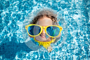 Happy child in swimming pool