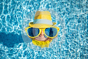 Happy child in swimming pool