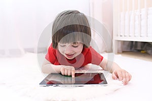 Happy child with tablet computer