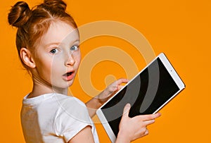 Happy child with tablet computer. Kid showing
