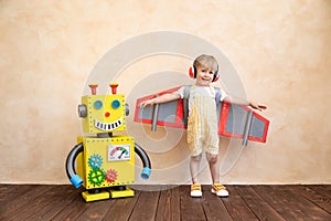 Happy child with toy robot