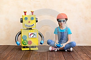 Happy child with toy robot