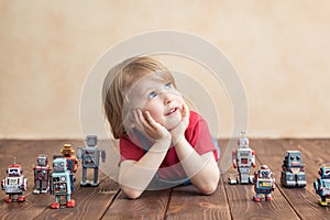 Happy child with toy robot