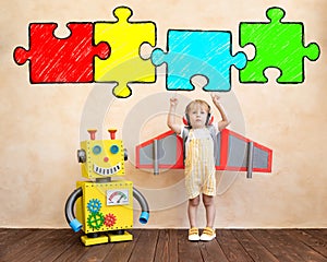 Happy child with toy robot