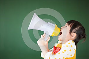 Happy child using a megaphone