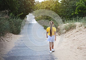 Happy child walking to summer. sea beach. Lifestyle photo Happiness freedom travel concept