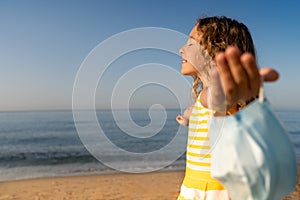 Happy child wearing medical mask outdoor