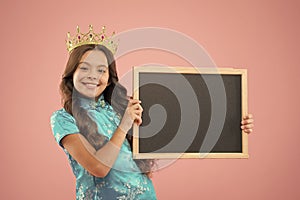 Happy childhood. cheerful princess hold school blackboard. School of success. school prom party advertising. Prom queen