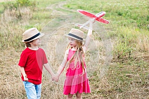 Happy childhood. Concept of dreams and travels. Enjoying nice weekend together. Two happy children boy and girl playing