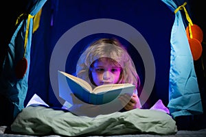 Happy childhood, dreaming child read bedtime stories, fairystory or fairytale. Kids reading books. Child reading story