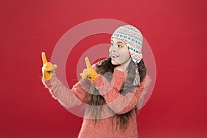 Happy childhood. kid fashion. Warm knitting tips. small child ready for winter. happy little girl in earflap hat