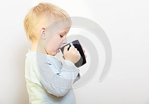 Happy childhood. Little boy kid child drinking tea