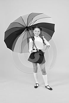 Happy childhood. Rainbow umbrella. Kid happy with umbrella. Fall weather forecast. Accessory for rainy day. Positive