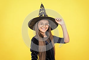 happy childhood. teenage child in witch hat and glasses. cheerful kid create miracles. carnival costume party. trick or