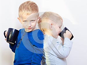 Happy childhood. Two brothers little boys drinking tea