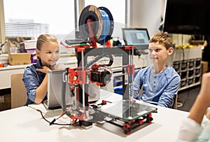 Happy children with 3d printer at robotics school