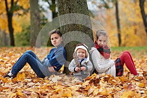 Happy children in autumn park