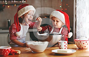 Happy children bake christmas cookies