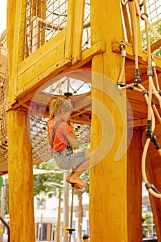 Happy children, boys, playing on playground in Tel Aviv, israel on hot summer day