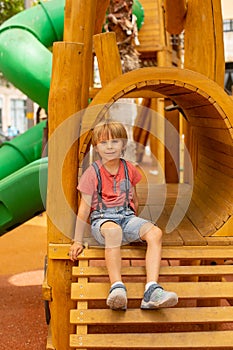 Happy children, boys, playing on playground in Tel Aviv, israel on hot summer day