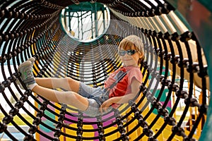 Happy children, boys, playing on playground in Tel Aviv, israel on hot summer day