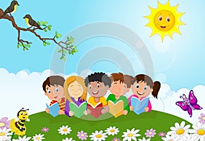 Happy children cartoon sitting on the grass while reading books