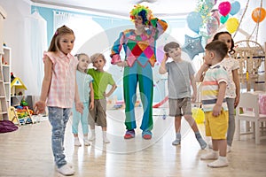 Happy children and clown on birthday party