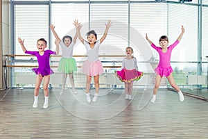 Happy children dancing on in hall, healthy life, kid's togethern