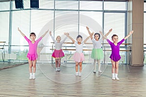 Happy children dancing on in hall, healthy life, kid's togetherness and happiness concept