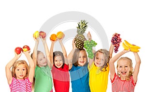 Happy children with fruits