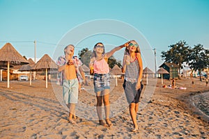 Happy children while having fun on the beach