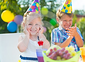 Happy children having fun at birthday party