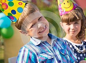Happy children having fun at birthday party