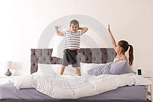 Happy children having pillow fight